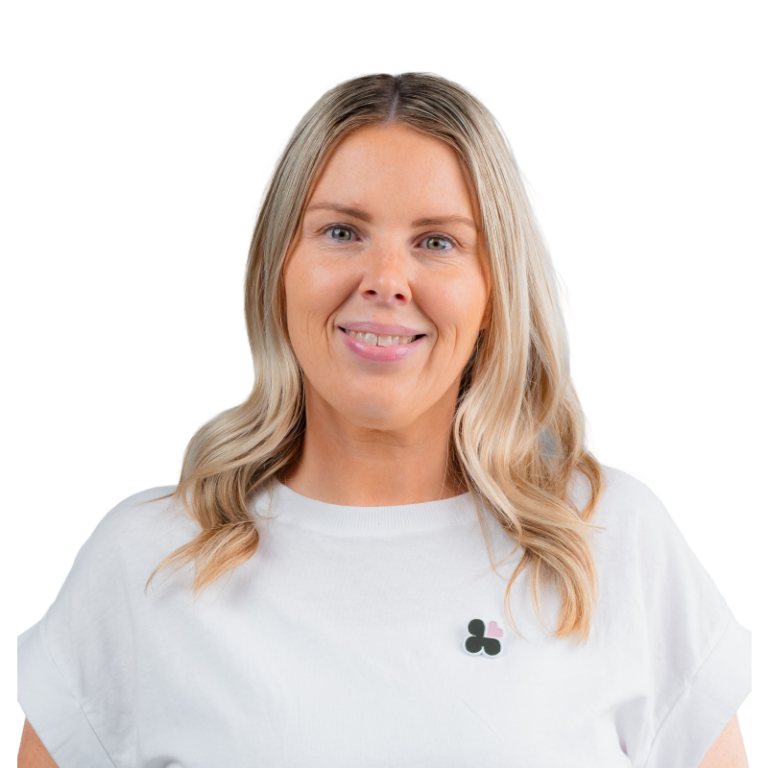 Smiling blonde woman in light gray shirt